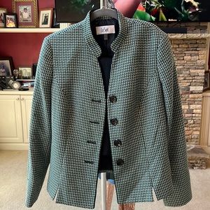 Beautiful tweed suit with solid black straight skirt. Good for work and church.